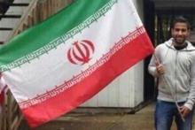 اهتزاز پرچم ایران در آمریکا توسط جوان سعودی (+تصویر) 
